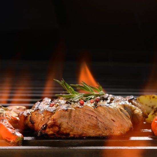 grilled-pork-steak-with-vegetable-on-the-flaming-g-2021-08-26-20-10-07-utc-scaled (1)